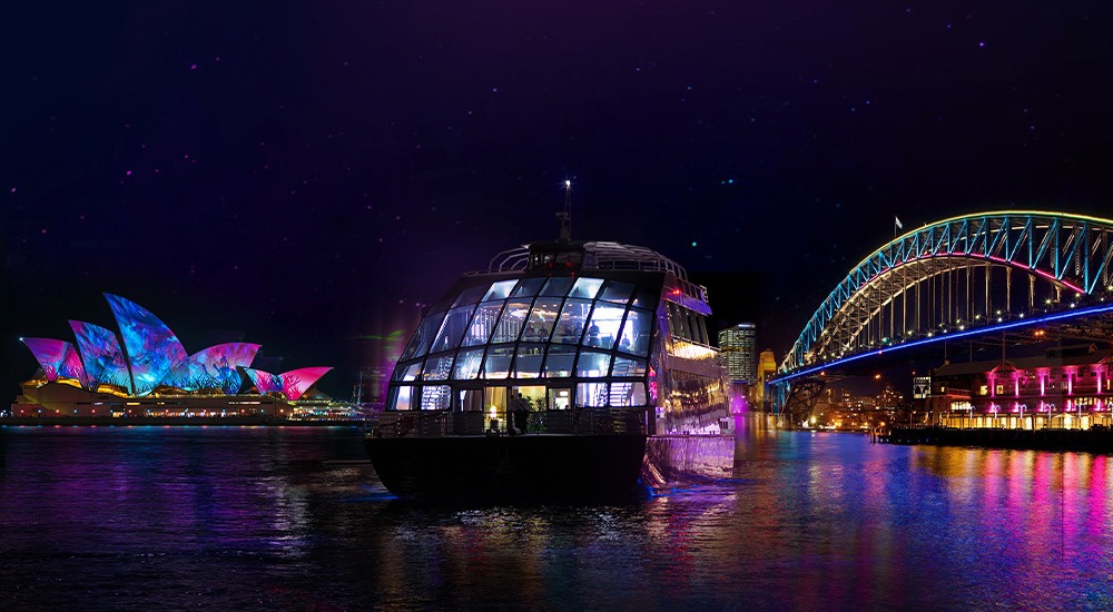 A photograph of the illuminated Clearview Vivid Sydney cruise on the water