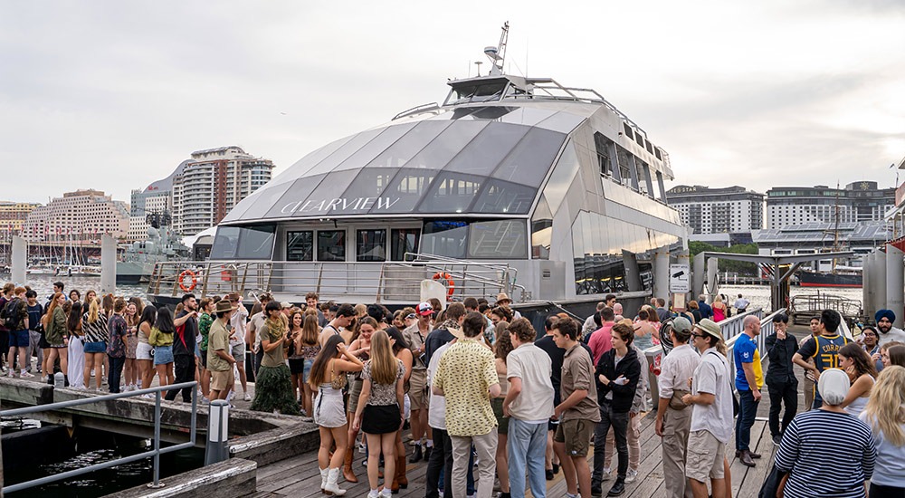 Clearview cruise boat at the wharf with people nearby