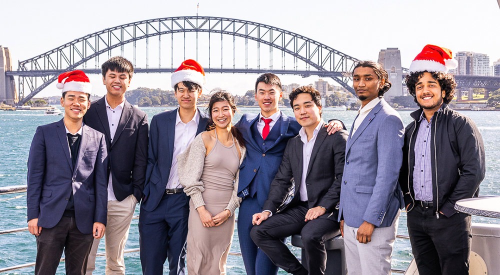 Colleagues celebrating a work Christmas party on board