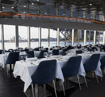 Luxury dining area of Clearview Glass Boat lunch cruise