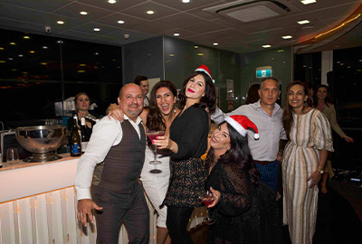 Guests enjoying drinks aboard the Clearview Xmas party dinner cruise