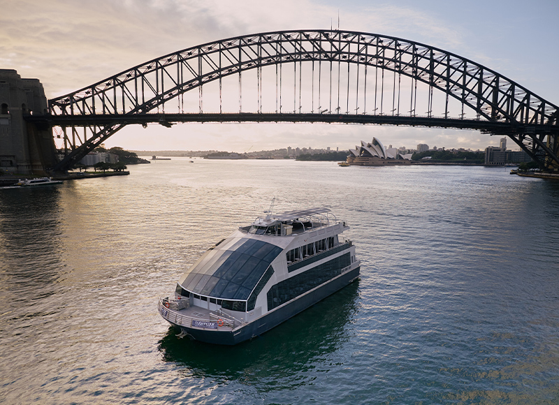 Premium Glass Boat dinner cruise on the serene blue waters of Sydney Harbour