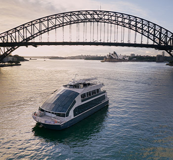 Clearview Glass Boat cruising past the Sydney Harbour Bridge